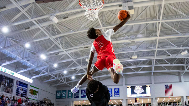 Columbus Explorers guard Jaxon Richardson (5) does a 360 dunk over a teammate during the 50th annual City of Palms Classic dunk contest at Suncoast Credit Union Arena in Fort Myers on Wednesday, Dec. 20, 2023. Columbus Explorers guard Jaxon Richardson (5) does a 360 dunk over a teammate during the 50th annual City of Palms Classic dunk contest at Suncoast Credit Union Arena in Fort Myers on Wednesday, Dec. 20, 2023.