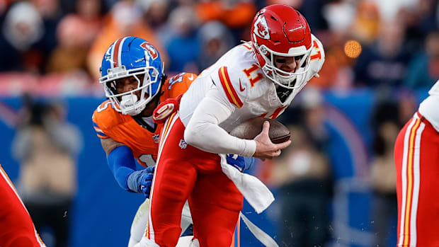 Kansas City Chiefs quarterback Carson Wentz (11) is sacked by Denver Broncos linebacker Nik Bonitto (15).