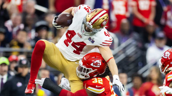 Feb 11, 2024; Paradise, Nevada, USA; San Francisco 49ers fullback Kyle Juszczyk (44) is hit by Kansas City Chiefs linebacker Nick Bolton (32) in the first half in Super Bowl LVIII at Allegiant Stadium. Mandatory Credit: Mark J. Rebilas-USA TODAY Sports