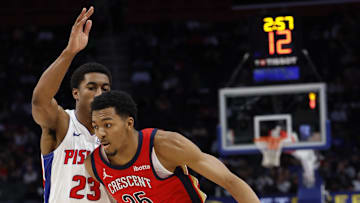 Mar 24, 2024; Detroit, Michigan, USA;  New Orleans Pelicans guard Trey Murphy III (25) dribbles on Detroit Pistons guard Jaden Ivey (23): Rick Osentoski-Imagn Images