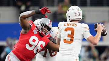 Ohio State Buckeyes defensive end Eddrick Houston (96) pressures Texas Longhorns quarterback Quinn Ewers (3) during the second half of the Cotton Bowl Classic College Football Playoff semifinal game at AT&T Stadium in Arlington, Texas on Jan. 10, 2025. Ohio State won 28-14.