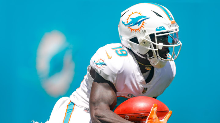 Miami Dolphins wide receiver Jakeem Grant (19) runs with the football during the first quarter of the game against the Buffalo Bills at Hard Rock Stadium in 2021.