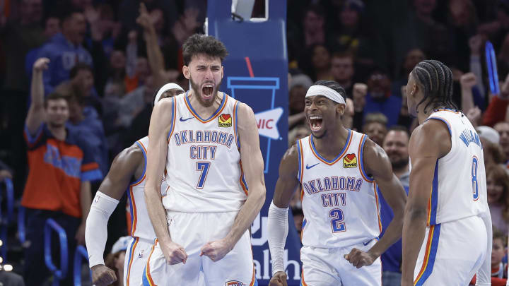 Dec 8, 2023; Oklahoma City, Oklahoma, USA; Oklahoma City Thunder forward Chet Holmgren (7), and guard Shai Gilgeous-Alexander (2) celebrate after Chet Holmgren scores a basket against the Golden State Warriors during the second half at Paycom Center. Mandatory Credit: Alonzo Adams-USA TODAY Sports