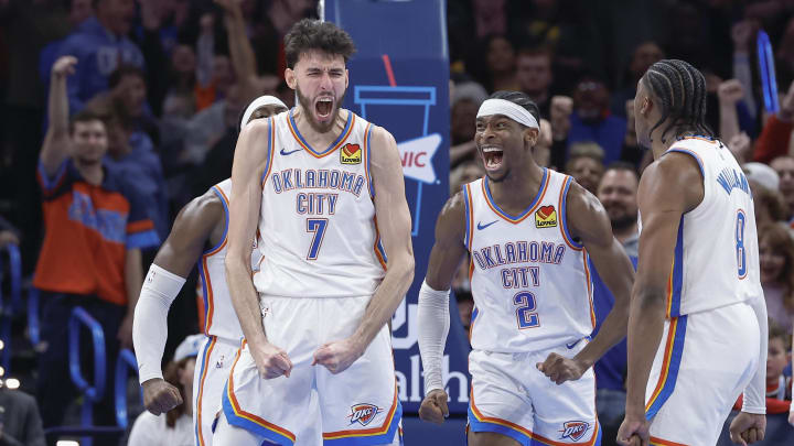 Dec 8, 2023; Oklahoma City, Oklahoma, USA; Oklahoma City Thunder forward Chet Holmgren (7), and guard Shai Gilgeous-Alexander (2) celebrate after Chet Holmgren scores a basket against the Golden State Warriors during the second half at Paycom Center. Mandatory Credit: Alonzo Adams-USA TODAY Sports