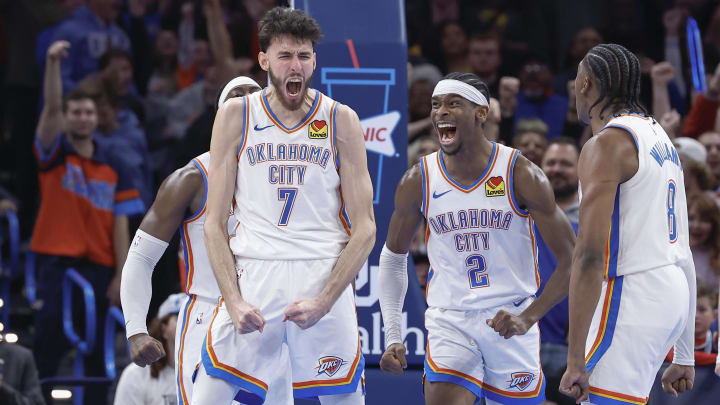 Dec 8, 2023; Oklahoma City, Oklahoma, USA; Oklahoma City Thunder forward Chet Holmgren (7), and guard Shai Gilgeous-Alexander (2) celebrate after Chet Holmgren scores a basket against the Golden State Warriors during the second half at Paycom Center. Mandatory Credit: Alonzo Adams-USA TODAY Sports