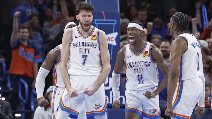 Dec 8, 2023; Oklahoma City, Oklahoma, USA; Oklahoma City Thunder forward Chet Holmgren (7), and guard Shai Gilgeous-Alexander (2) celebrate after Chet Holmgren scores a basket against the Golden State Warriors during the second half at Paycom Center. Mandatory Credit: Alonzo Adams-Imagn Images