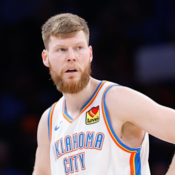 Nov 25, 2023; Oklahoma City, Oklahoma, USA; Oklahoma City Thunder forward Davis Bertans (9) looks up court during a time out against the Philadelphia 76ers during the second half at Paycom Center. Mandatory Credit: Alonzo Adams-Imagn Images