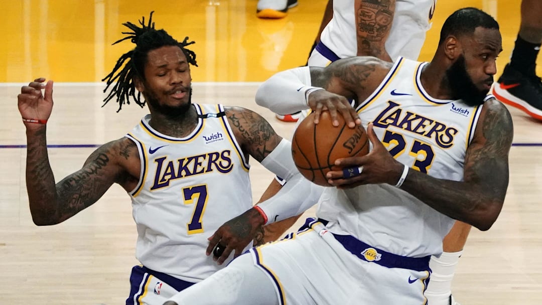 May 2, 2021; Los Angeles, California, USA; Los Angeles Lakers forward LeBron James (23) gets a rebound in front of guard Ben McLemore (7) against the Toronto Raptors  during the second half at Staples Center. Mandatory Credit: Gary A. Vasquez-Imagn Images