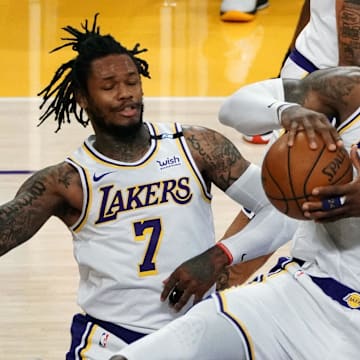 May 2, 2021; Los Angeles, California, USA; Los Angeles Lakers forward LeBron James (23) gets a rebound in front of guard Ben McLemore (7) against the Toronto Raptors  during the second half at Staples Center. Mandatory Credit: Gary A. Vasquez-Imagn Images