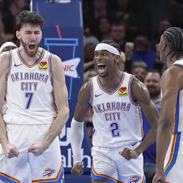 Dec 8, 2023; Oklahoma City, Oklahoma, USA; Oklahoma City Thunder forward Chet Holmgren (7), and guard Shai Gilgeous-Alexander (2) celebrate after Chet Holmgren scores a basket against the Golden State Warriors during the second half at Paycom Center. Mandatory Credit: Alonzo Adams-Imagn Images