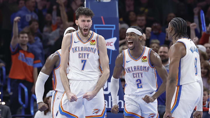 Dec 8, 2023; Oklahoma City, Oklahoma, USA; Oklahoma City Thunder forward Chet Holmgren (7), and guard Shai Gilgeous-Alexander (2) celebrate after Chet Holmgren scores a basket against the Golden State Warriors during the second half at Paycom Center. Mandatory Credit: Alonzo Adams-Imagn Images