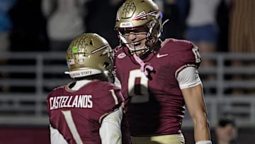 Nov 1, 2025; Tallahassee, Florida, USA; Florida State Seminoles quarterback Tommy Castellanos (1) celebrates a touchdown with wide receiver Duce Robinson (0) during the second half against the Wake Forest Demon Deacons at Doak S. Campbell Stadium. Mandatory Credit: Melina Myers-Imagn Images