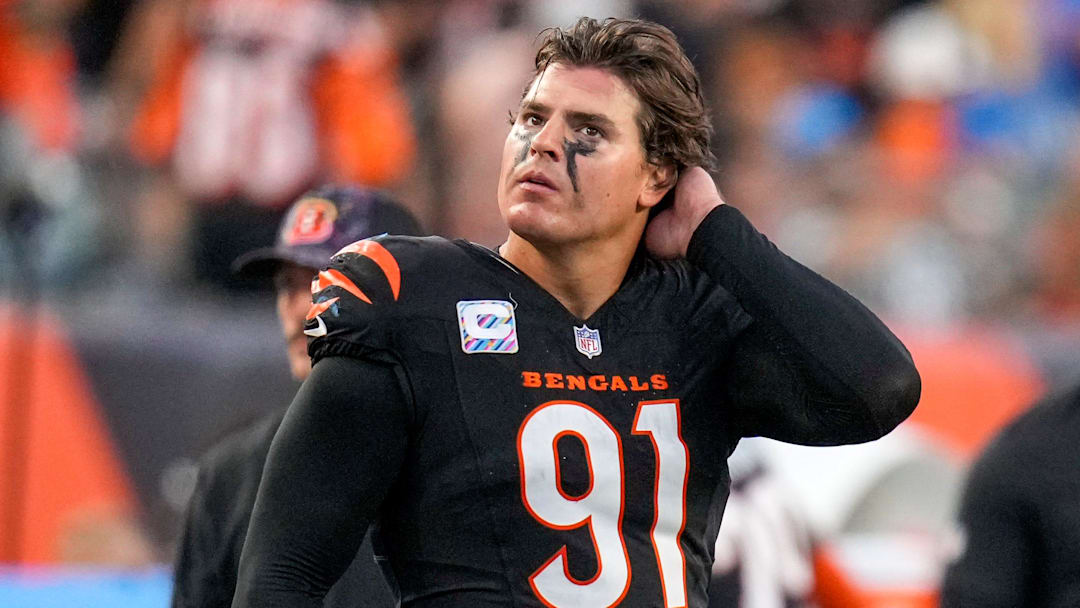 Cincinnati Bengals defensive end Trey Hendrickson (91) watches a replay as the Detroit Lions celebrate a touchdown in the fourth quarter of the NFL Week 5 game between the Cincinnati Bengals and the Detroit Lions at Paycor Stadium in downtown Cincinnati on Sunday, Oct. 5, 2025. The Bengals continued a losing streak, falling 37-24 to the Lions.