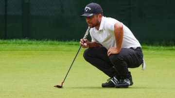 Jun 23, 2024; Cromwell, Connecticut, USA; Xander Schauffele studies the third hole green prior to making a putt during the final round of the Travelers Championship golf tournament at TPC River Highlands. Mandatory Credit: Gregory Fisher-USA TODAY Sports