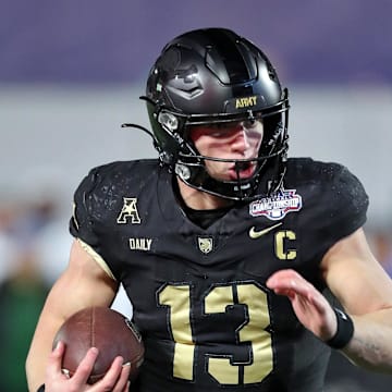 Dec 6, 2024; West Point, NY, USA; Army Black Knights quarterback Bryson Daily (13) carries the ball for a touchdown against the Tulane Green Wave during the first half at Michie Stadium. Mandatory Credit: Danny Wild-Imagn Images