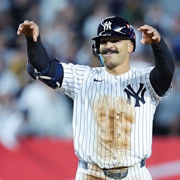 Oct 1, 2025; Bronx, New York, USA; New York Yankees center fielder Trent Grisham (12) celebrates after hitting a double during the seventh inning against the Boston Red Sox during game two of the Wildcard round for the 2025 MLB playoffs at Yankee Stadium. Mandatory Credit: Brad Penner-Imagn Images