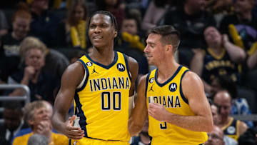 Oct 21, 2022; Indianapolis, Indiana, USA; Indiana Pacers guard Bennedict Mathurin (00) and guard T.J. McConnell (9) after a foul in the first half against the San Antonio Spurs at Gainbridge Fieldhouse. Mandatory Credit: Trevor Ruszkowski-Imagn Images
