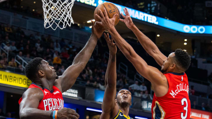 Nov 7, 2022; Indianapolis, Indiana, USA; Indiana Pacers center Myles Turner (33) New Orleans Pelicans forward Zion Williamson (1) and guard CJ McCollum (3) fight for a rebound in the second half at Gainbridge Fieldhouse. Mandatory Credit: Trevor Ruszkowski-USA TODAY Sports