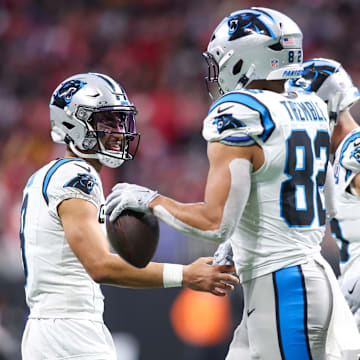 Jan 5, 2025; Atlanta, Georgia, USA; Carolina Panthers quarterback Bryce Young (9) celebrates with tight end Tommy Tremble (82) after a touchdown pass against the Atlanta Falcons in the third quarter at Mercedes-Benz Stadium. 
