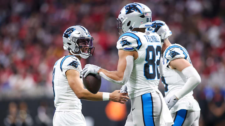 Jan 5, 2025; Atlanta, Georgia, USA; Carolina Panthers quarterback Bryce Young (9) celebrates with tight end Tommy Tremble (82) after a touchdown pass against the Atlanta Falcons in the third quarter at Mercedes-Benz Stadium. 