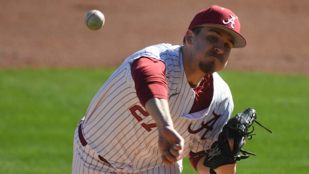 Feb 18, 2023; Bessemer, AL, USA;  Alabama pitcher Ben Hess (27) delivers a pitch as the Crimson Tide faced Richmond in the season-opening series.