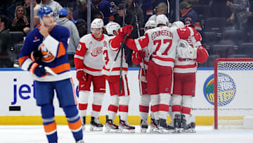 Oct 22, 2024; Elmont, New York, USA; Detroit Red Wings players celebrate after defeating the New York Islanders at UBS Arena. Mandatory Credit: Brad Penner-Imagn Images