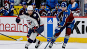 Mar 22, 2024; Denver, Colorado, USA; Columbus Blue Jackets defenseman Ivan Provorov (9) and Colorado Avalanche right wing Valeri Nichushkin (13) battle for the puck in the third period at Ball Arena. Mandatory Credit: Isaiah J. Downing-Imagn Images