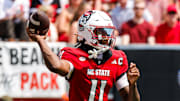Sep 6, 2025; Raleigh, North Carolina, USA; North Carolina State Wolfpack quarterback CJ Bailey (11) throws the football during the first half of the game against Virginia Cavaliers at Carter-Finley Stadium. Mandatory Credit: Jaylynn Nash-Imagn Images
