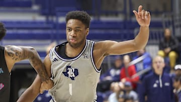 Jan 24, 2024; Houston, Texas, USA; Rice Owls guard Noah Shelby (1) defends against Florida Atlantic Owls guard Jalen Gaffney (12) during the second half at Tudor Fieldhouse. 