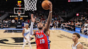 Mar 23, 2025; Atlanta, Georgia, USA; Philadelphia 76ers forward Justin Edwards (19) shoots against the Atlanta Hawks in the first half at State Farm Arena. Mandatory Credit: Brett Davis-Imagn Images