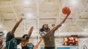 Team Thad’s Jasper Johnson (2) lays the ball up against Team Oak Soldiers’ Doug Langford (13) during the Nike Elite Youth Basketball League session one on Saturday, April 27, 2024 at the Memphis Sports & Event Center in Memphis, Tenn.