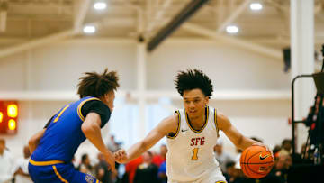 Team SFG’s Brayden Burries (1) looks to make a play against Team Boo Williams during the Nike Elite Youth Basketball League session one on Friday, April 26, 2024 at the Memphis Sports & Event Center in Memphis, Tenn.