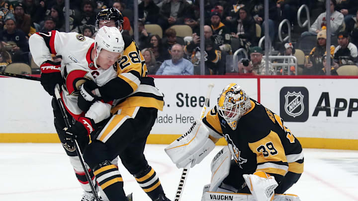 Jan 11, 2025; Pittsburgh, Pennsylvania, USA;  Pittsburgh Penguins defenseman Marcus Pettersson (28) and goaltender Alex Nedeljkovic (39) defend the net against Ottawa Senators left wing Brady Tkachuk (7) during the second period at PPG Paints Arena. Mandatory Credit: Charles LeClaire-Imagn Images
