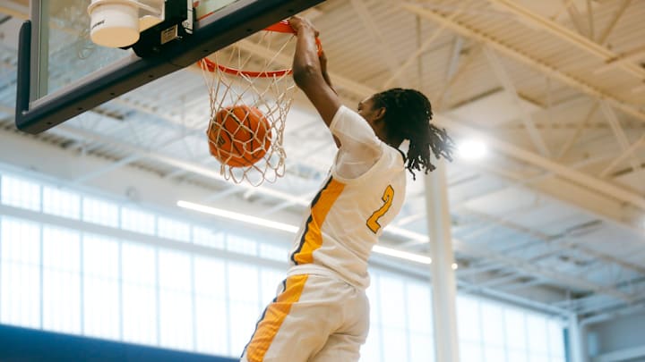 Team Thad’s Jasper Johnson (2) dunks the ball on a fast break during a game against Team Bradley Beal Elite during the Nike Elite Youth Basketball League session one on Friday, April 26, 2024 at the Memphis Sports & Event Center in Memphis, Tenn.