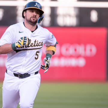 May 21, 2024; Oakland, California, USA; Oakland Athletics designated hitter J.D. Davis (5) rounds the bases after hitting a home run against the Colorado Rockies during the third inning at Oakland-Alameda County Coliseum