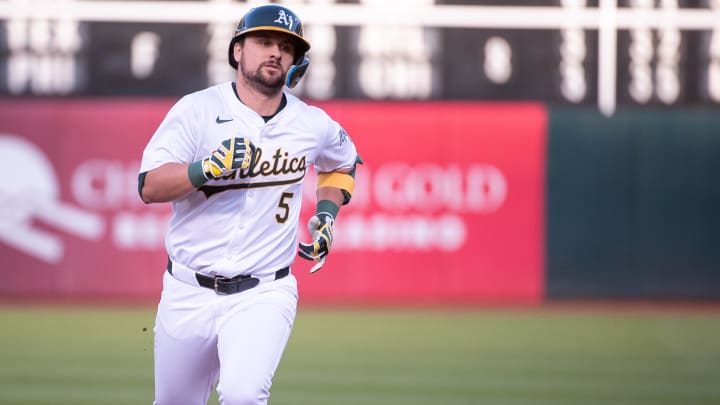 May 21, 2024; Oakland, California, USA; Oakland Athletics designated hitter J.D. Davis (5) rounds the bases after hitting a home run against the Colorado Rockies during the third inning at Oakland-Alameda County Coliseum