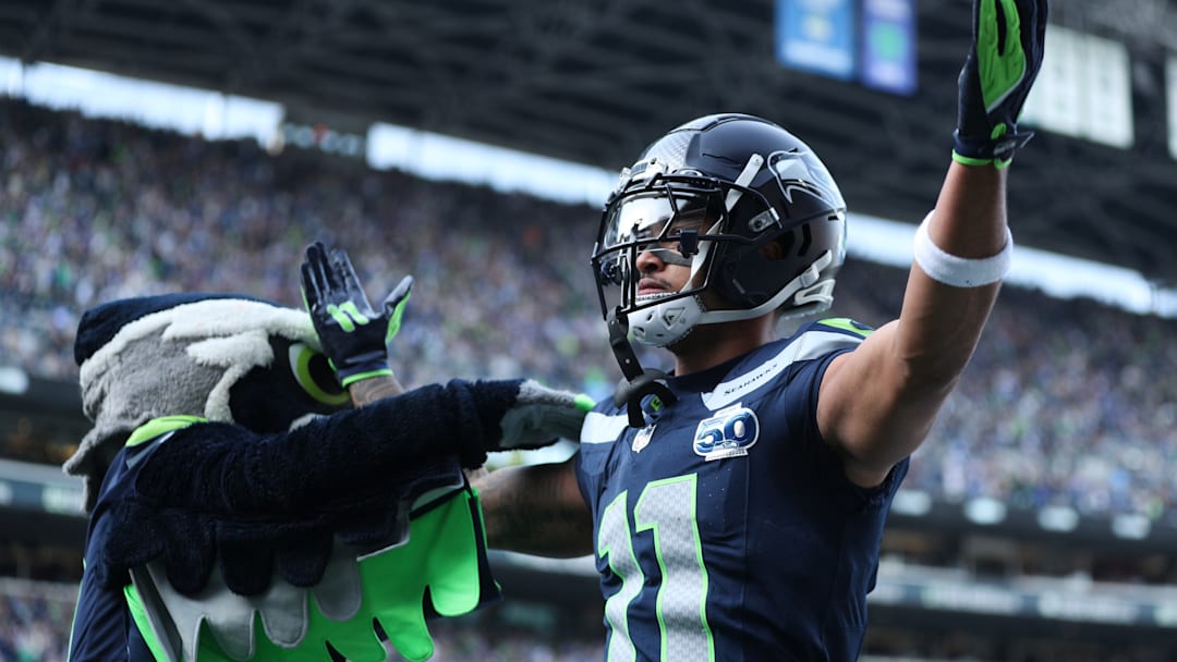 Nov 9, 2025; Seattle, Washington, USA; Seattle Seahawks wide receiver Jaxon Smith-Njigba (11) celebrates after scoring a touchdown during the first quarter against the Arizona Cardinals at Lumen Field. 