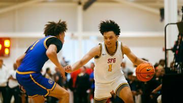 Team SFG’s Brayden Burries (1) looks to make a play against Team Boo Williams during the Nike Elite Youth Basketball League session one on Friday, April 26, 2024 at the Memphis Sports & Event Center in Memphis, Tenn.