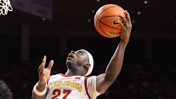 Dec 3, 2025; Ames, Iowa, USA;  Iowa State Cyclones guard Killyan Toure (27) shoots over Alcorn State Braves guard Alex Hawkins (10) during the first half at James H. Hilton Coliseum. 