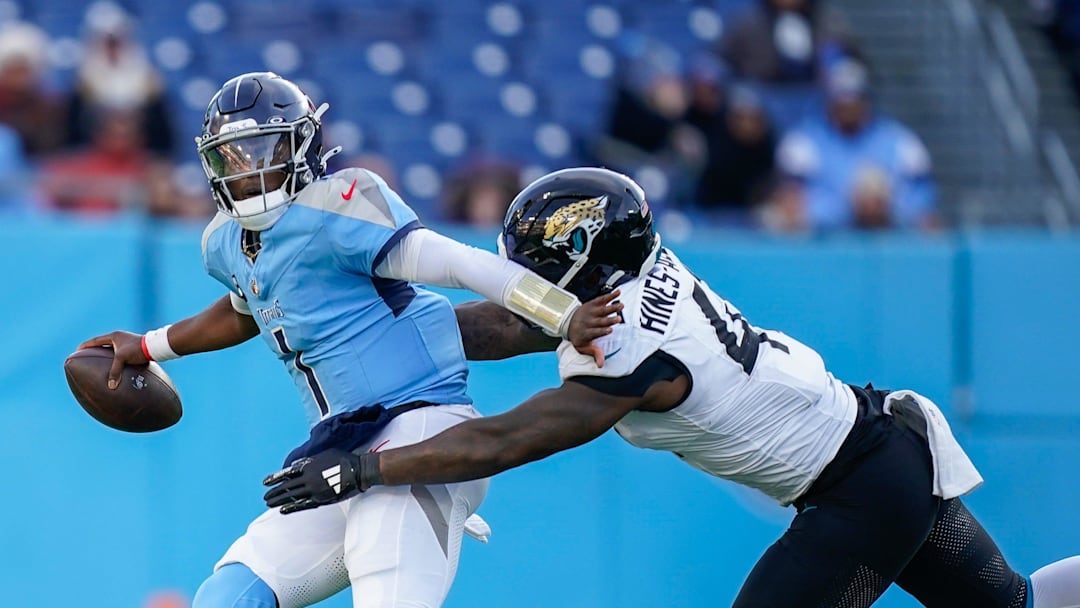 Tennessee Titans quarterback Cam Ward (1) is sacked by Jacksonville Jaguars defensive end Josh Hines-Allen (41) during the fourth quarter at Nissan Stadium in Nashville, Tenn., Sunday, Nov. 30, 2025.