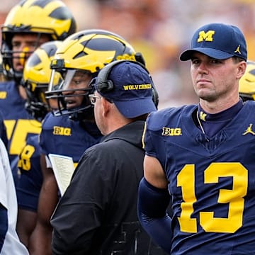 Sep 7, 2024; Ann Arbor, Michigan, USA; Michigan quarterback Jack Tuttle (13) at a timeout against Texas during the first half at Michigan Stadium. Mandatory Credit: Junfu Han-USA TODAY Network via Imagn Images