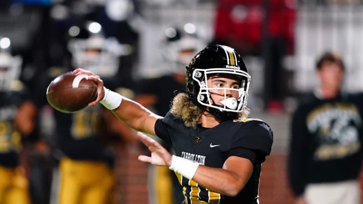 Oct 20, 2023; Carrollton, GA, USA; Carrollton Trojans quarterback Julian Lewis (10) drops back to pass against the Westlake Lions during the first half at Grisham Stadium. The 15-year-old Carrollton High student has already committed to playing for the University of Southern California Trojans and has been considered one of the top high school quarterback prospects. Mandatory Credit: John David Mercer-USA TODAY Sports