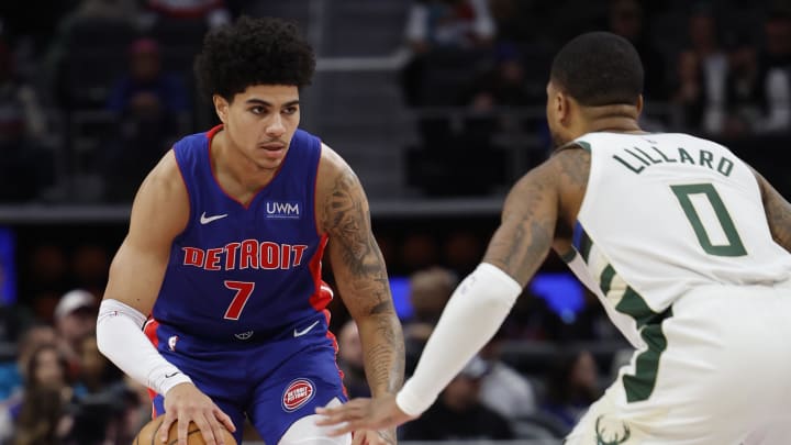 Jan 20, 2024; Detroit, Michigan, USA;  Detroit Pistons guard Killian Hayes (7) dribbles while defended by Milwaukee Bucks guard Damian Lillard (0) in the first half at Little Caesars Arena. Mandatory Credit: Rick Osentoski-USA TODAY Sports