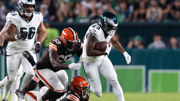 Aug 17, 2023; Philadelphia, Pennsylvania, USA; Philadelphia Eagles running back Rashaad Penny (23) breaks the tackle attempt of Cleveland Browns safety Ronnie Hickman Jr. (33) during the first quarter at Lincoln Financial Field. Mandatory Credit: Bill Streicher-USA TODAY Sports