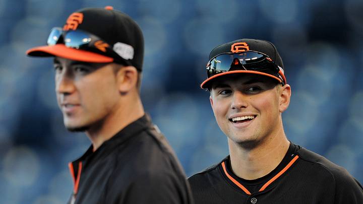 Kansas City, MO, USA; San Francisco Giants first baseman Travis Ishikawa (left) and second baseman Joe Panik (12) during practice the day before the start of the 2014 World Series at Kauffman Stadium. Mandatory Credit: Christopher Hanewinckel-USA TODAY Sports
