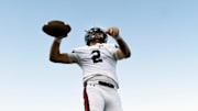 Nashville Christian quarterback Jared Curtis (2) passes as he warms up before an high school football scrimmage against Franklin Road Academy Friday, Aug. 16, 2024, in Nashville, Tenn.