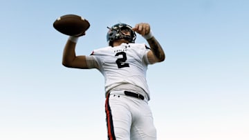 Nashville Christian quarterback Jared Curtis (2) passes as he warms up before a high school football scrimmage against Franklin Road Academy on Friday, Aug. 16, 2024, in Nashville, Tenn.