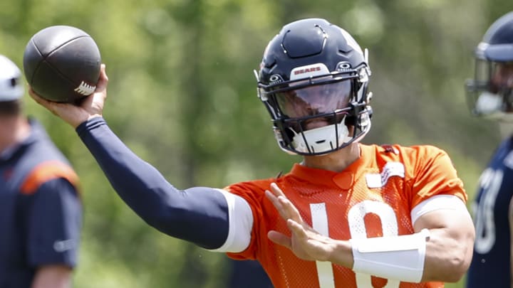 May 31, 2024; Lake Forest, IL, USA; Chicago Bears quarterback Caleb Williams (18) throws the ball during organized team activities at Halas Hall. 