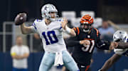 Sep 18, 2022; Arlington, Texas, USA; Dallas Cowboys quarterback Cooper Rush (10) and Cincinnati Bengals defensive end Trey Hendrickson (91) in action during the game between the Dallas Cowboys and the Cincinnati Bengals at AT&T Stadium. Mandatory Credit: Jerome Miron-Imagn Images