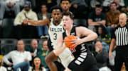Jan 7, 2025; Waco, Texas, USA;  Cincinnati Bearcats guard Simas Lukosius (41) controls the ball as Baylor Bears guard Jeremy Roach (3) defends during the first half at Paul and Alejandra Foster Pavilion. Mandatory Credit: Chris Jones-Imagn Images